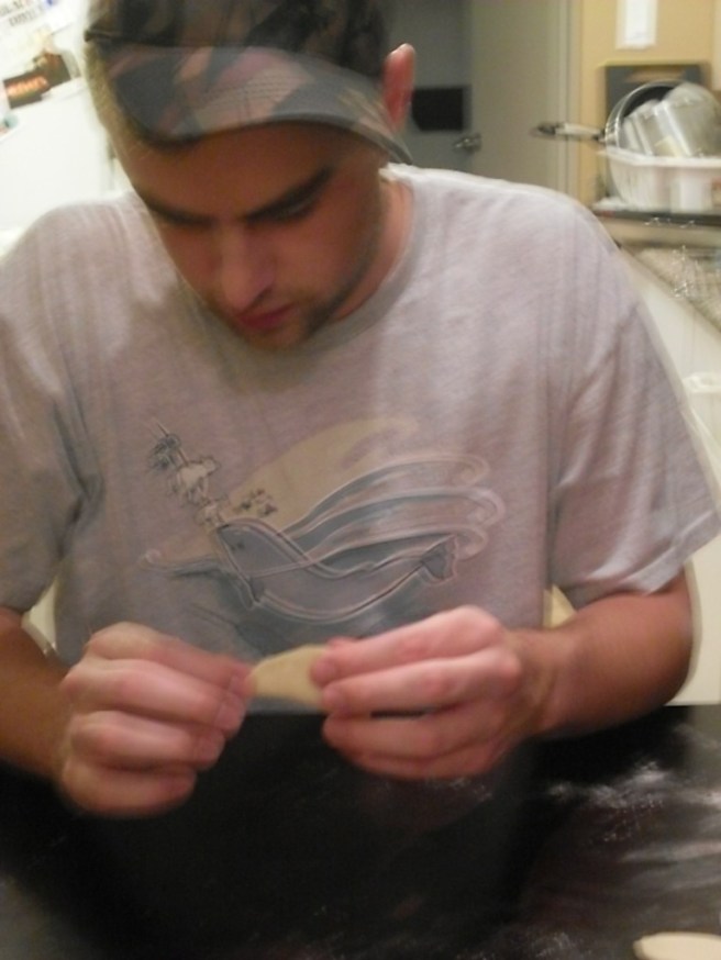 Nick pinches pierogies.