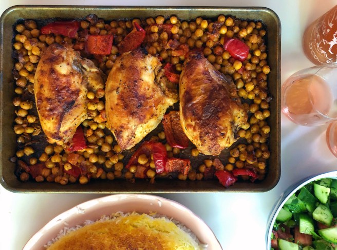 Sheet pan chicken with chickpeas and red peppers.